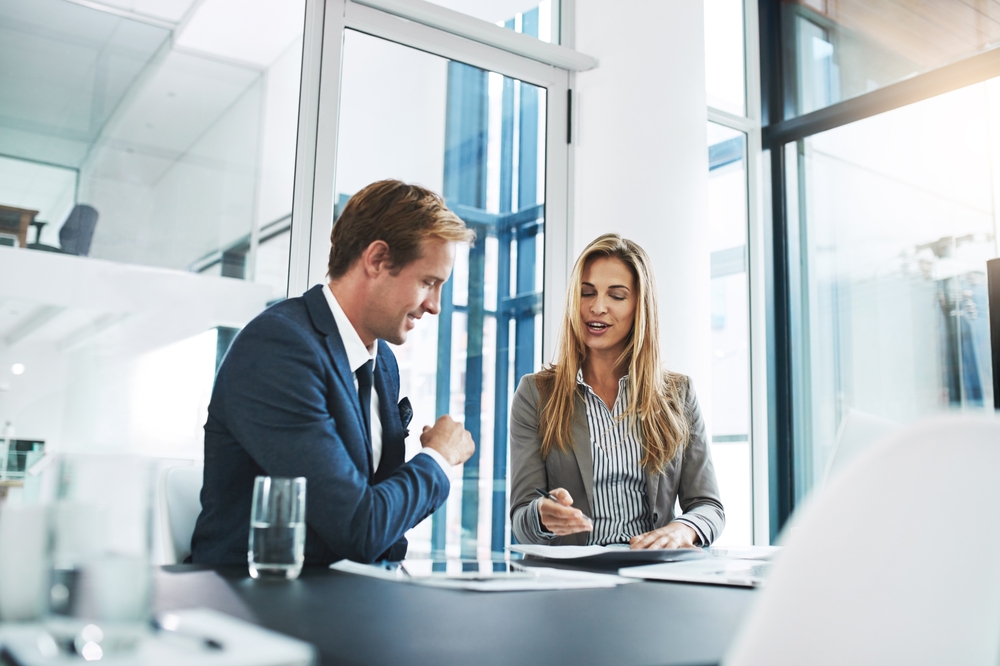 Financial advisor, client and table with paperwork for meeting, contract or insurance agreement.